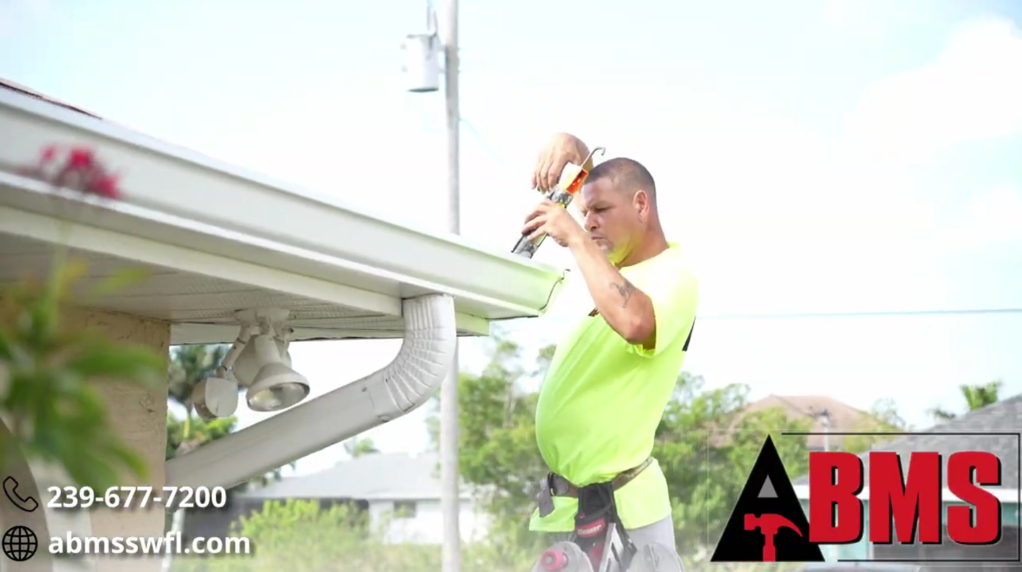 A guy working on gutters